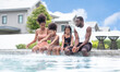 © Montri - happy african american family relaxing together at the swimming pool. Family playing in a pool. vacation or summer concept.