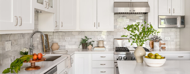 Style Home Still Lifestyle Image. Contemporary Kitchen Design with White Cabinets, Counters, and Backsplash. Interior Design Social Media Banner.