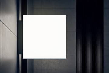 Wall Mural - Front view on white blank illuminated square screen with place for your brand name or text on dark wall at night. 3D rendering, mock up