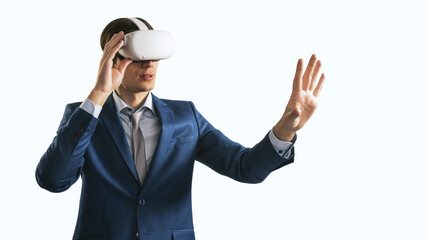 Aufkleber - Young businessman working in virtual reality office in VR glasses, presses his hand virtual interface on abstract white backdrop. Innovate and future technology concept, close up