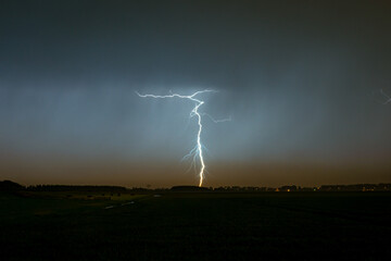 Wall Mural - lightning strikes at dusk