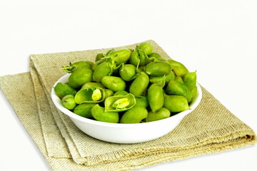 Wall Mural - fresh green chickpeas pod in bowl isolated on white background with copy space
