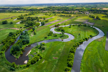 Wall Mural - Curvy River Bends. Nida in Poland. Aerial Drone View