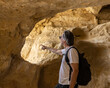 © Guzel - A man stands inside the cave of Matala, Greece