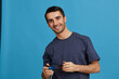 © SHOTPRIME STUDIO - man in blue t-shirt 3d glasses entertainment gesture with hands isolated background