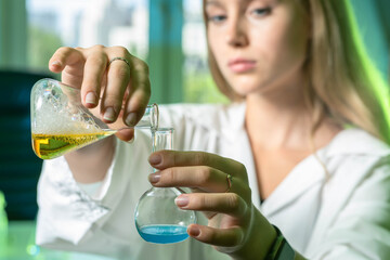 Poster - researcher with glass laboratory chemical test tubes with liquid for analytical, medical, pharmaceut