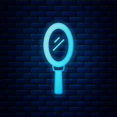 Sticker - Glowing neon Hand mirror icon isolated on brick wall background. Vector