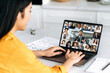 © Kateryna - Virtual meeting, brainstorm of colleagues, online conversation. Over shoulder view of a girl to a laptop screen, talking on video call with multiracial business group, discussing the project, start-up