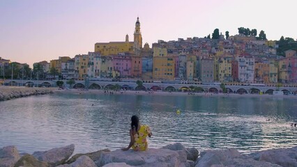 Wall Mural - Menton France, woman on vacation at the Cote d Azur France, View on old part of Menton, Provence-Alpes-Cote d'Azur, France Europe