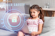 Cute little girl with laptop at home. Concept of safety and parental control