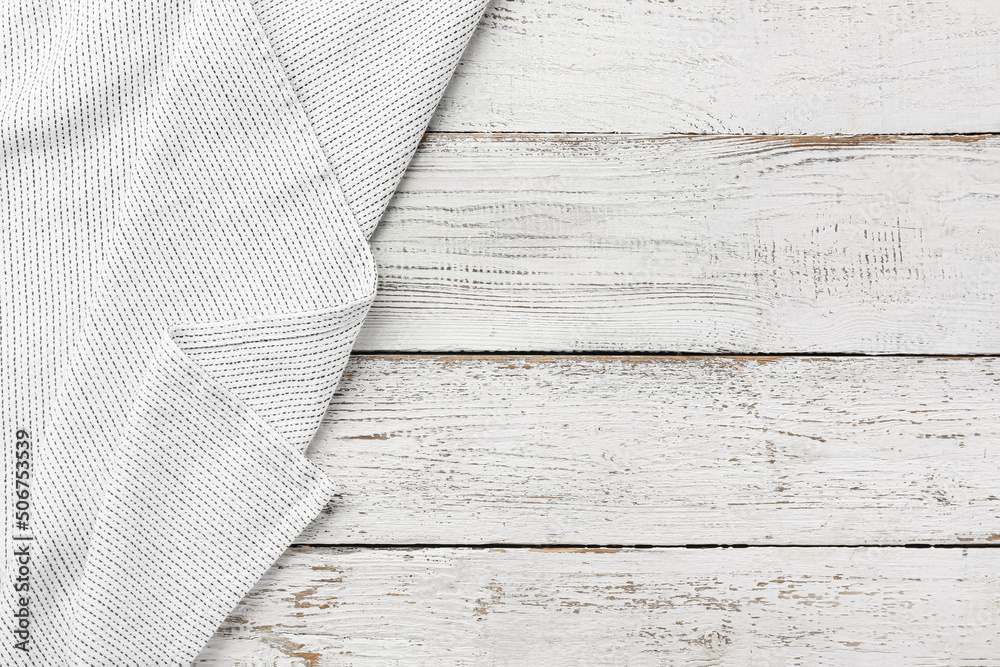 New napkin for picnic on white wooden background