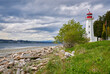 © maxdigi - Cape Mudge Lighthouse Quadra Island BC. The Cape Mudge Lighthouse on Quadra Island overlooking Discovery Passage and Campbell River on the far shore. BC, Canada.