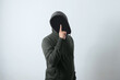 faceless man with silent hand gesture