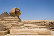 Architectural detail of the Giza pyramid complex with the Great Sphinx of Giza in the foreground and, in the background, the Pyramid of Cheops