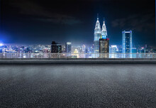 Kuala Lumpur Urban Cityscape Skyline Night Scene With Empty Asphalt Floor On Front.