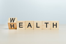 Wealth And Health Concept, Word Wealth To Health On Wooden Cube Blocks. Growth Investment Future Value Success.