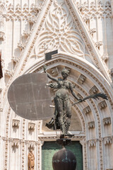 Wall Mural - Giraldillo bronze copy made in 1998 in front of the Price door of Seville Cathedral