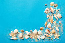 Summer Time Concept Flat Lay Composition With Beautiful Starfish And Sea Shells On Colored Table, Top View