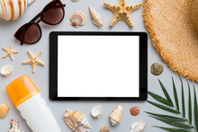 Flat Lay Composition With Tablet And Beach Accessories On Colored Background. Tablet Computer With Blank Screen Mock Up With Copy Space