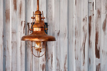 Outdoor Copper Electric Wall Sconce With Etched Seedy Glass On Galvanized Steel Plate Wall.