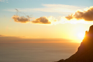 Wall Mural - mountain and sunset above sea