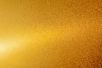 Wall Mural - Gold wall texture background. Yellow shiny gold metal sheet surface with light reflection, vibrant metallic golden luxury wallpaper