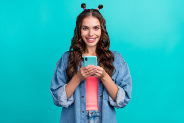 Wall Mural - Photo of young pretty girl use smartphone share app download subscribe isolated over turquoise color background