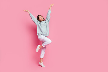 Wall Mural - full size photo of young lovely excited woman hands up rejoice glad isolated over pink color backgro
