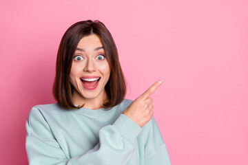 Wall Mural - Photo of young excited girl indicate finger empty space proposition promo select discount isolated over pink color background