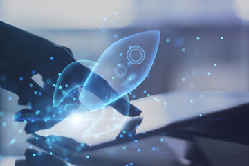 Poster - Successful business and startup concept with double exposure of human finger on digital tablet screen and virtual blue light rocket