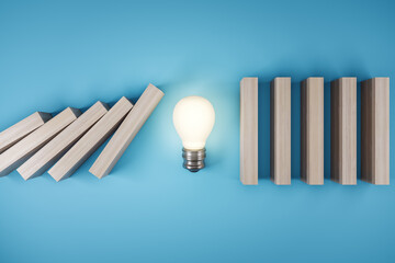 Wall Mural - Business crisis and solution concept with switched on light bulb stopping wooden pieces of a domino effect on abstract blue background. 3D rendering