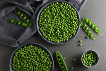 Fresh Green Peas In Plates On A Gray Background. 