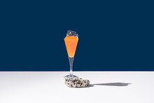Orange Tobiko Caviar Placed On Cocktail Glass With Ice