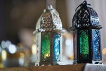 Ornamental Arabic Lantern With Burning Candle Glowing  And  Beautiful Tea Set  As Background