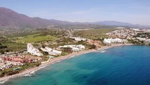Aerial View Of Beach With Apartments And Hotels At Estepona In The Costa Del Sol. Pan Right View Across Alboran Sea