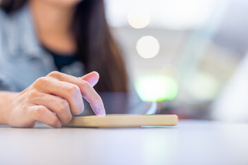 Canvas Print - Woman use mobile phone at restaurant