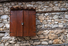 Old Wooden Door In Stone Wall