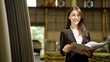 © comzeal - Portrait of Asian young woman factory quality inspector hold document folder and looking at camera