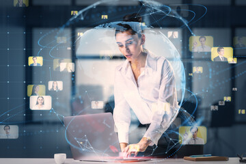 Poster - Business society and networking concept with young businesswoman using laptop on the table and virtual screen with digital world map globe and people profile pictures she contacted