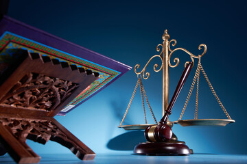 sharia law concept , gavel hammer libra scale and holly koran