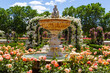 © marta - Botanical garden of Madrid in the Retiro park. Rose garden in spring. Flower-filled gardens with fountains and metal arches.