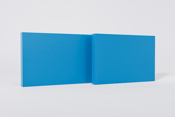 Wall Mural - Mockup of a rectangular book with a blank glossy blue cover on white background. Front and back cover visible. Isolated with clipping path.	