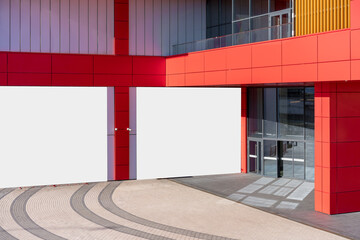 Wall Mural - Two horizontal advert banners fixed on wall of city mall building near glass door entrance outdoor