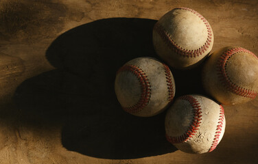 Canvas Print - Grunge baseballs on wood background for old ball equipment. 