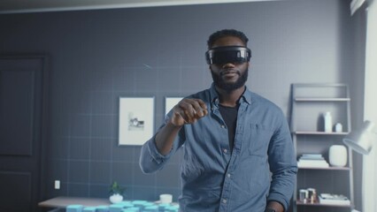 African American man in the cyberspace of the virtual world of the meta universe uses the interfaces of different applications.