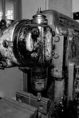 Wall Mural -  Metalworking workshop, metal processing machines.  Vintage Industrial Machinery in a old factory - black and white photo