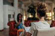 © bernardbodo - View from behind of female psychotherapist on session