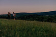 © bernardbodo - Middle aged couple on vacation hiking at sunrise