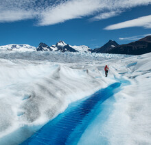 A Deep Cravasse Filled With Rich Blue Water On The Perito Moreno