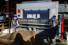 Technician Operators Working With With Sheet Metal On CNC Hydraulic Press Brake